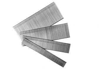 Strips of finishing nails or brads for an power nail gun in various lengths isolated on white