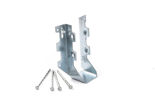 A galvanized steel joist hanger with nails as might be used n residential construction