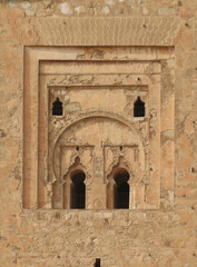 Fototapeta na wymiar Minaret of the Koutoubia Mosque in the historic city of Marrakech (11th century). Morocco. Detail of decoration and windows of the south facade. UNESCO World Heritage. 