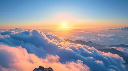 Foto op Canvas The sunrise peeks above a sea of clouds viewed from the peak of a high mountain © Creative_Bringer
