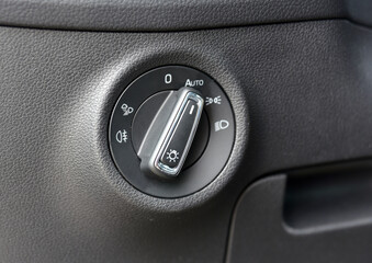 Closeup image of car lighting control switch - 765276933