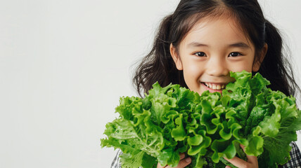Asian girl with Romaine lettuce, symbolizing health and wellness, against a white background.