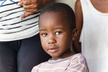 african village life, small boy portrait in a late afternoon