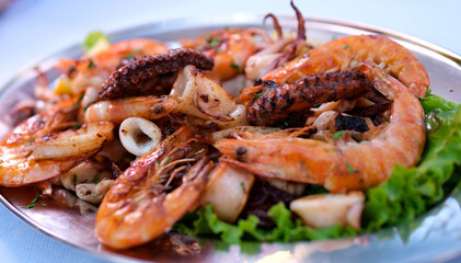 Tiger prawns cooked in garlic butter sauce and vegetable salad to go with.