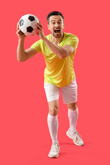 Fototapeta na wymiar Portrait of male football player on red background