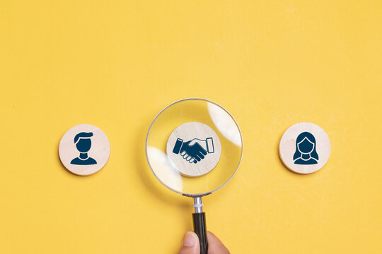 Mediation concept. Mediation between married couples, divorce and the role of the mediator. Wooden block with icon of woman and man and mediation.