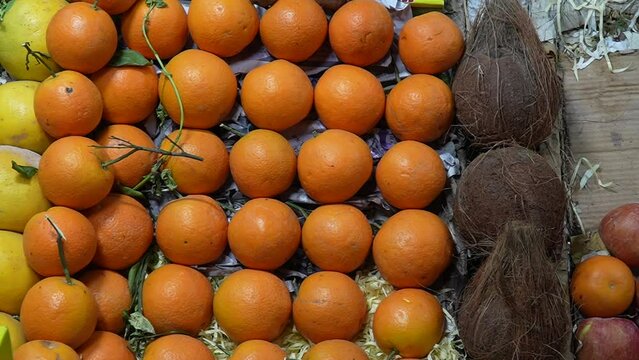 oranges and coconuts for sale at the market slow motion 240fps 