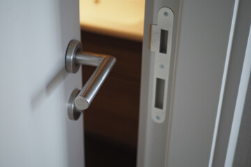  gray bathroom door slightly open .