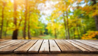 wooden desk on autumn blur abstract natural background