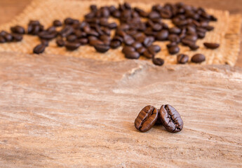 Coffee beans on wooden table background