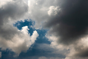 Dramatic dark storm rain clouds black sky background. Dark thunderstorm clouds rainny atmosphere. Meteorology danger windstorm disasters climate. Dark cloudscape storm disaster gloomy gray cloud sky