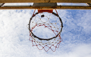 Basketball hoop on sky background