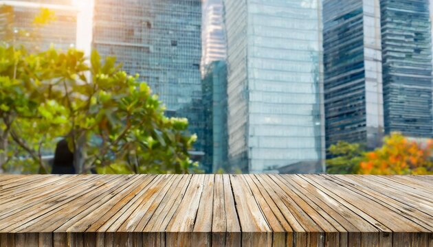 the empty wooden table top with blur background of business district and office building in autumn exuberant image