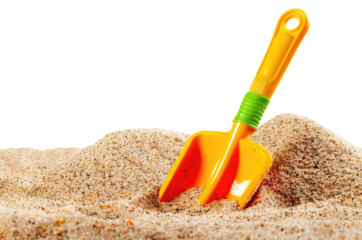 Children's shovel in sand isolated on transparent background