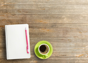 Obraz na płótnie Canvas Office desk with notebook and coffee