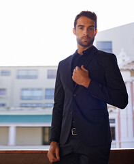 Portrait, confident and businessman on balcony in suit and formal fashion for professional in city....