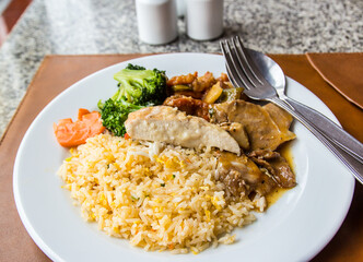 Fried rice topped with chicken and pork