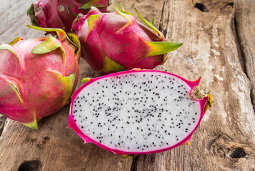 Fresh dragon fruit on wooden table