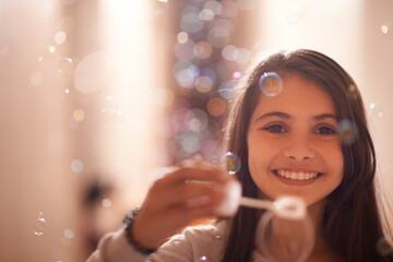 Home, happy and portrait of child with bubbles for relaxing, resting and playing in bedroom. Youth,...
