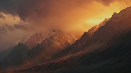 Naklejka premium The landscape with an early sunrise in the mountains seems to make time slow down: warm rays illuminate every detail of the landscape, as if giving it special significance and beauty.