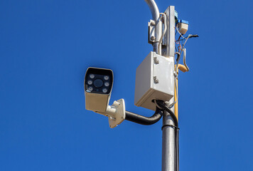 The security camera against blue sky