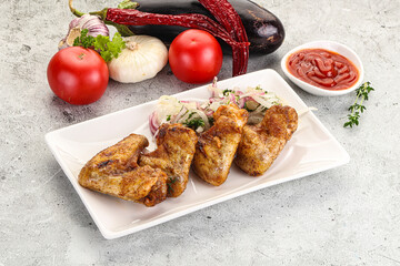 Grilled chicken wings with sauce