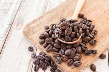 Coffee beans on wooden background