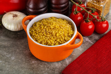 Dry wheat bulgur cereal heap