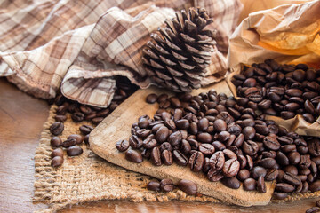 Coffee beans on wooden table background