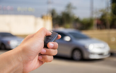 Hand holding car key