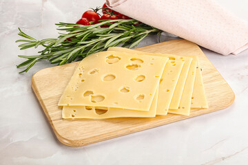 Sliced maasdam cheese with holes
