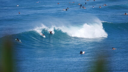 Many surfers trying to catch a good waves at the world famous Honolua bay in Maui