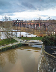 Aerial view of floods from Severn river,after heavy,and arched railway...