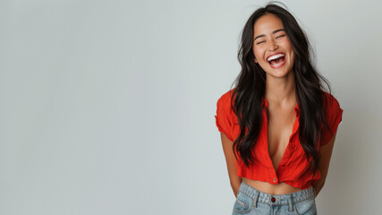 Fototapeta premium Malay woman wearing red shirt smiling laugh out loud isolated on grey