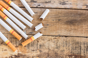 Cigarette roll on old wooden table - obrazy, fototapety, plakaty