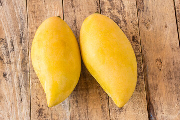 Mango fruit on old wooden table