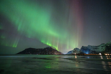 The best of view at Skagsanden beach with a beautiful aurora borealis. on Norway 