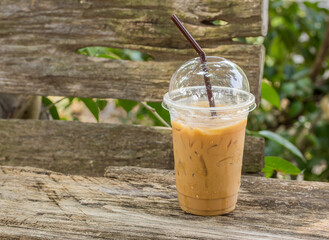 Ice coffee on a wooden table