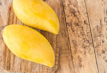 Mango fruit on old wooden table