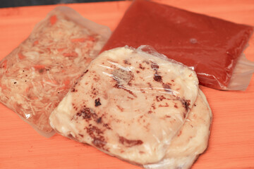 ake-away pupusas wrapped in paper and plastic, served with curtido and sauce, ready to enjoy anywhere.