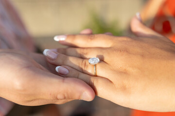 Obraz na płótnie Canvas Engagement ring on finger