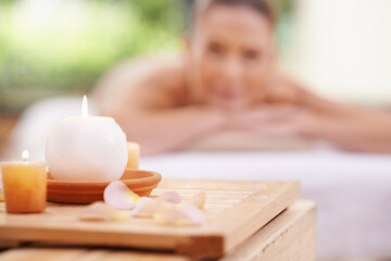Candles, petals and holistic healing at spa with aromatherapy, wellness and treatment for self...
