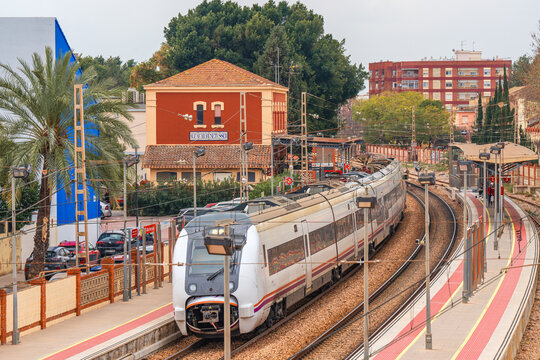 Alfafar, Spain. March 20, 2024. A middle-distance train at the Alfafar-Benet&uacute;sser station