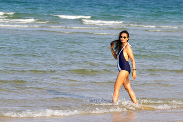 Woman body beautiful with bikini relax on beach