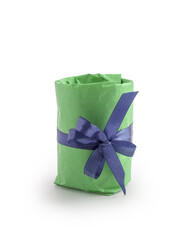 Present wrapped with green paper with violet ribbon bow isolated on white background