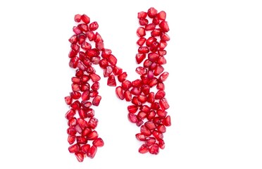 N English Alphabet Capital Letter Written with Pomegranate Seeds Isolated on White Background