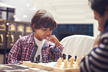 Child, father and chess game with thinking strategy or checkmate move with knight, king or queen....