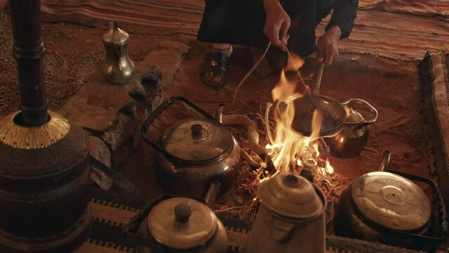 A Bedouin man Roasting Coffee Beans