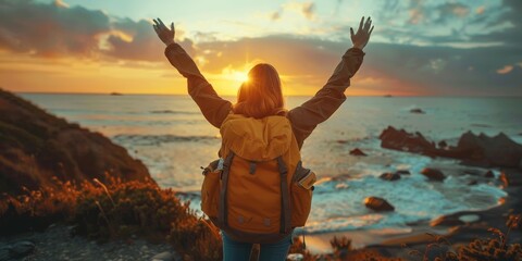 Confident woman with backpack with arms up relaxing at sunset seaside during a trip , traveler enjoying freedom in serene nature landscape, Generative AI - obrazy, fototapety, plakaty