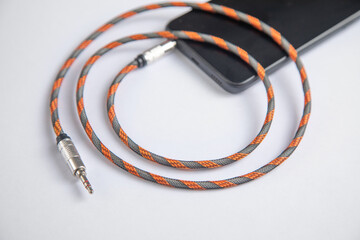 Audio cable connected in smartphone. Technology